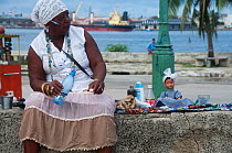 Women selling Santeria totems in Regla, Havana, Cuba, October, 2011.