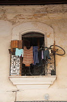 Laundry and a bicycle on an apartment balcony, Havana, Cuba, October 2011.