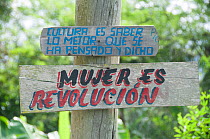 Politcial slogans nailed to a tree stating: "Culture is knowing the best that has been thought and said" and "Woman is revolution" near Baracoa, Cuba, November 2011.