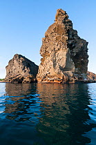 Pinnacle Rock, remnant of old eroded tuff cone, Bartolome Island. Galapagos Islands, June 2011.