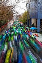 Crowd of people running down street in the St. Patrick's Day Dash, Seattle, Washington, USA, 16th of March 2014.