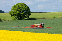 Crop sprayer working in an arable field, Moor Crichel, Dorset, England, UK, May 2012.