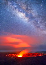 Glowing gases rising from Halemaumau Crater, Kilauea Caldera, in evening with Milky Way in the sky above.  Hawaii Volcanoes National Park, Hawaii, August 2010.