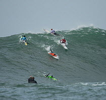 Surfers competing in the Mavericks 2014 surfing competition, Half Moon Bay, California, USA, January 2014.