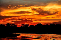 Sunset over in Cuiaba River, Pantanal of Mato Grosso, Mato Grosso State, Western Brazil.