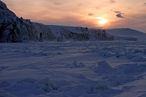 Snowy landscape of cliffs and fast ice on the coast of  Wrangel Island at sunset,  Far Eastern Russia, March 2011.