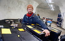 Man checking newly arrived seed samples at Svalbard Global Seed Vault, Svalbard, Norway, October 2012.