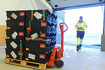 Newly arrived seed samples at airport, before security control, Svalbard Global Seed Vault, Svalbard, Norway, October 2012.