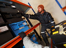 Ola Westengen director of the vault placing new seeds in the vault, Svalbard Global Seed Vault, Svalbard, Norway, October 2012.
