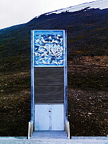Svalbard Global Seed Vault entrance with glittering facade designed by artist Dyveke Sanne. Light reflected in steel, mirrors, and prisms in landscape, Svalbard, Norway, October 2012.