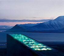 Svalbard Global Seed Vault, with glittering facade designed by artist Dyveke Sanne. Light reflected in steel, mirrors, and prisms in landscape, Svalbard, Norway, October 2012.