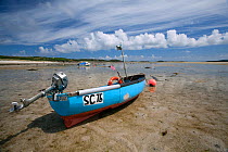 Small motor boat on the beach at St Martin's, The Isles of Scilly