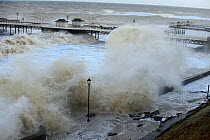 High waves lashing Cromer seafront and pier during storm surge., Norfolk, England, UK. December 2013.