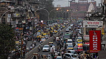 Time-lapse of people and traffic outside The Red Fort at sunset, Delhi, India, March 2011.