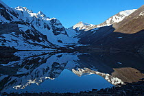 Reflections in lake on Makalu Mountain, Mount Qomolangma National Park, Dingjie County, Qinghai-Tibet Plateau, Tibet, China, Asia. May 2013.