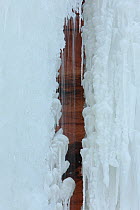 Water flowing in crevis of patterned ice formation, Apostle Islands National Lakeshore, Lake Superior, Squaw Bay, Wisconsin, February 2014.