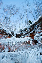Icicles hanging from sandstone cliffs on shoreline, Apostle Islands National Lakeshore, Lake Superior, Squaw Bay, Wisconsin, February 2014.