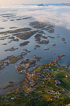 View of Lovund archipelago in sea fog from top of Lundeura, Luroy, Helgeland, Nordland, Norway, July 2009