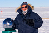 Photographer Cherry Alexander at the ceremonial South Pole, Antarctica.