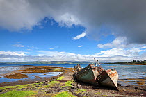 Abandoned fishing boats on beach, Salen, Isle of Mull, Scotland, UK. June 2013.