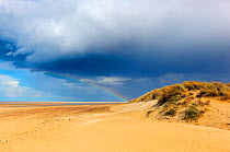 Rainbow over Holkham Bay National Nature Reserve, Norfolk, UK, April 2013.