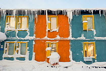 An old, snow covered wooden accommodation building in Sabetta, South Tambey Gas field, Yamal, Siberia, Russia. February 2014.