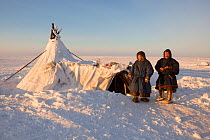 Grisha (right) and Gosha Vanuitto, Nenets reindeer herders, at their winter camp on the tundra in the South Tambey Gas Field, Yamal Peninsula, Siberia, Russia. February 2014.