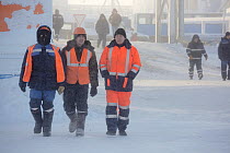 Gas field workers wearing winter clothing in Sabetta, South Tambey Gas Field, Yamal Peninsula, Siberia, Russia. February 2014.