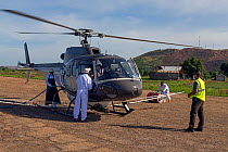 Helicopter is loaded with insecticides for Food and Agriculture Organization (FAO) locust control operation. Miandrivazo Airport, Madagascar, December 2013.