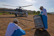 Helicopter is loaded with insecticides for Food and Agriculture Organization (FAO) locust control operation. Miandrivazo Airport, Madagascar, December 2013.