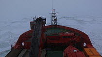 icebreaker moving through pack ice in thick fog, Peterson Bank, Antarctica.