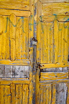 Locked yellow door, Santorin Island, Greece, May 2009.