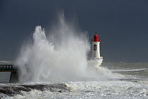 Waves crashing at harbor entrance during storm. Les Sables d' Olonne, Vendee, France, March 2014.