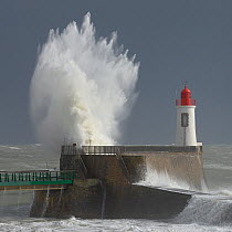 Waves crashing at harbor entrance during storm. Les Sables d' Olonne, Vendee, France, March 2014.