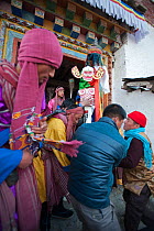 Carrying the 'Cake' (containing all the evil) out of the monastery to be burned at the end of the first day of the Torgya festival. Galdan Namge Lhatse Monastery,Tawang, Arunachal Pradesh, India. Janu...