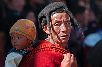 Man in traditional Monpa tribe dress (typical head dress made from Yak hair) during Torgya festival. Galdan Namge Lhatse Monastery,Tawang, Arunachal Pradesh, India. January 2014.