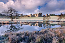 Alnwick Castle on a frosty morning with reflections, Alnwick, Northumberland, UK. March 2014.