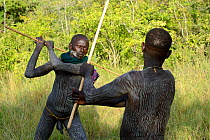 'Donga' stick fighters, young men of the Suri / Surma tribe. Omo river Valley, Ethiopia, September 2014.