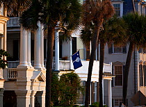 State flag of South Carolina displayed on a home along the East Battery Road in Charleston, South Carolina, USA.