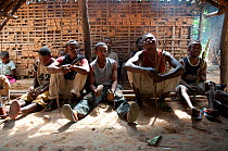 Mbuti Pygmy men chanting before going on hunt, Democratic Republic of the Congo, Africa, November 2011.