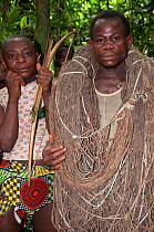 Mbuti Pygmies initiation hunt, men with bow and arrows and another with a throwing net, Ituri Rainforest Democratic Republic of the Congo, Africa