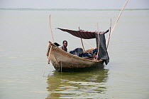 Fishermen in boats on Lake Albert at the border of  Democratic Republic of the Congo and Uganda, Democratic Republic of the Congo, Africa, January 2012.