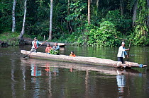 Mongo people crossing the Ituri River, Ituri Rainforest, Democratic Republic of the Congo, January 2012.