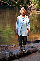 Mongo man standing next to river,  Democratic Republic of the Congo, Africa, November 2011.