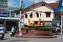 Roundabout with fake ivory tusks, Nakhon Sawan, Thailand, December 2012.