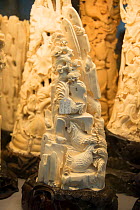 Carved ivory tusks, for sale in shop on Nathan Road, Kowloon, Hong Kong, December 2012.