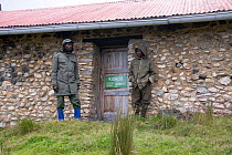 Park rangers by house, Virunga National Park World Heritage Site, Democratic Republic of the Congo, February 2012.