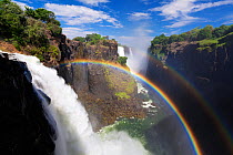 Rainbow in the spray over Victoria Falls. Zimbabwe, Africa. November 2012.