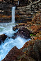 Waterfall into the ocean. Waterfall Bluff, Pondoland, Eastern Cape, South Africa. April 2014. Non-ex.