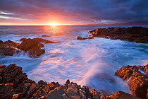 Sunset over a rocky coastline. De Kelders, Western Cape, South Africa. April 2010. Non-ex.